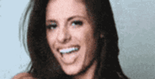 a close up of a woman 's face with her tongue sticking out .