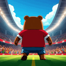 a bear in a red shirt and blue shorts is walking on a field