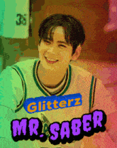 a young man wearing a glitterz mr. saber jersey