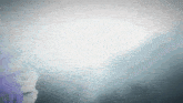 a blurred image of a person 's face with a white background