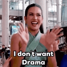 a woman in a green dress says i don 't want drama .