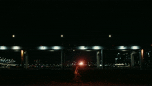 a blurry picture of a woman holding a light