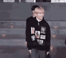 a man in a black sweatshirt is standing next to a woman in a white shirt .