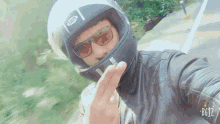 cut off racer helmet peace sign selfie