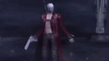 a person is holding a gun in their hand .