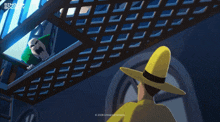 a man in a yellow hat is standing next to a man in a green shirt on a staircase