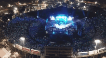 an aerial view of a stadium full of people with a sign that says tcl on it