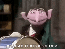 count von count from sesame street is sitting in front of a drum and saying ahaha that 's alot of 8 .