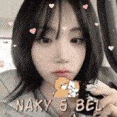 a close up of a woman 's face with hearts and a teddy bear on it .