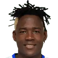 a close up of a man 's face with dreadlocks on his head