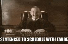 a judge sitting at a desk with the words sentenced to schedule with tarre written below him