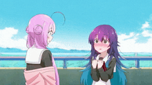 a girl with purple hair and a pink haired girl are standing next to each other