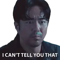 a man with a sticker that says i can 't tell you that on it