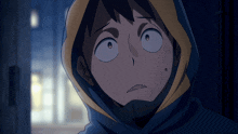 a close up of a person wearing a hood
