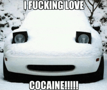 a white car is covered in snow with the words i fucking love cocaine