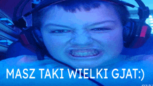 a boy wearing headphones with the words masz taki wielki gjat