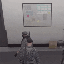 a group of soldiers are standing in a room in front of a white board .