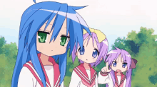 a girl with blue hair and green eyes stands next to two other girls