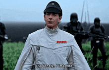 a man in a star wars uniform says " it 's lonely i imagine "