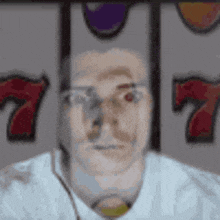 a man in a white shirt and tie is standing in front of a slot machine .