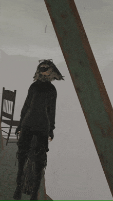 a person with a furry head is standing in front of a chair