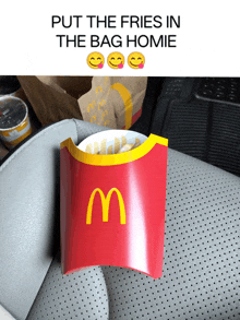 a mcdonald 's french fries holder in a car