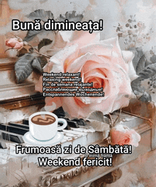 a cup of coffee sits on a saucer next to a piano and a rose
