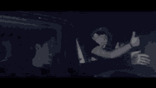 a blurry picture of a person standing in a dark room with a light shining on them