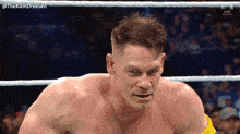 a man in a wrestling ring with the name thekamdreesen on the bottom right