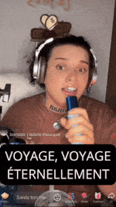 a woman singing into a microphone with the words voyage voyage eternellement written below her