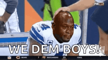 a football player is crying with the words we dem boys on the screen
