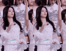 a group of girls are standing in a row with their arms up in the air