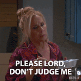 a woman holding a casserole dish with the words please lord don 't judge me