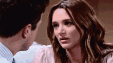 a man and a woman looking at each other