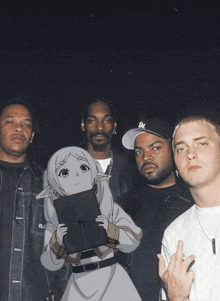 snoop dogg ice cube and eminem are posing for a picture