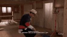 a man in a cowboy hat is standing in a room with the words original casting by juel bestrop