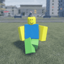 a roblox character is standing in a grassy field with buildings in the background