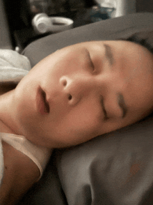 a person is sleeping with their eyes closed