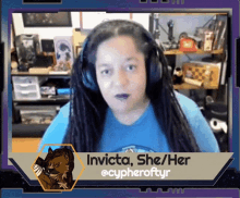 a woman wearing headphones says invicta she / her @cypheroftyr