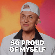 a man wearing a white baseball cap and a white jacket says so proud of myself
