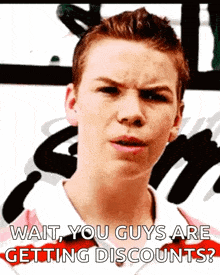 a young man with a serious look on his face is asking if you guys are getting discounts