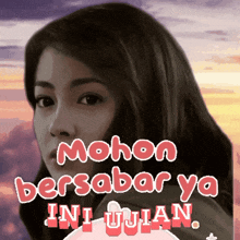 a picture of a woman with the words " mohon bersabar ya ini ujian " above her