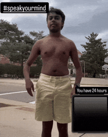 a shirtless man is standing in front of a sign that says speak your mind