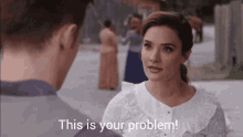 a woman talking to a man with the words " this is your problem " written below her