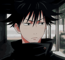 a close up of a person with black hair and a black jacket