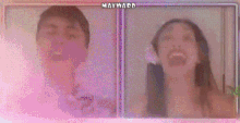 a man and a woman are laughing with their mouths open in a video chat .