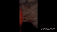 a man with red paint on his face making a funny face
