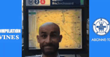a man is standing in front of a sign that says rochechouard