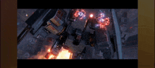 a video game screen shows a robot being destroyed by a fireball