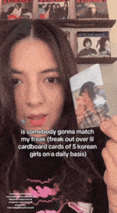 a girl holding a cardboard card that says " is somebody gonna match my freak " on it